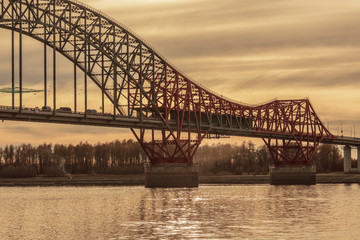 Bridge "Red Dragon" over Irtysh river in the Khanty-Mansiysk in sunset