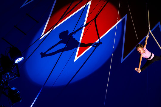 Circus, aerial rope, shadow of girl, artist, splits