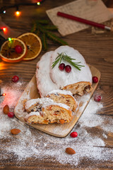 Traditional Christmas German cake Stollen with raisins and nuts, sliced