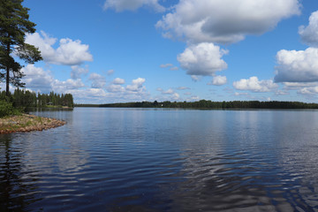 Fototapeta na wymiar Water and shore of Lake Ranuanjarvi in Finland