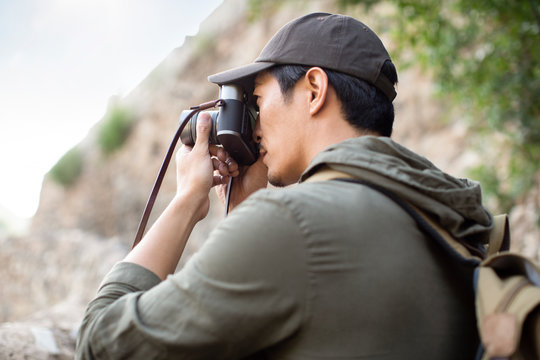 Chinese photographer taking photos in village