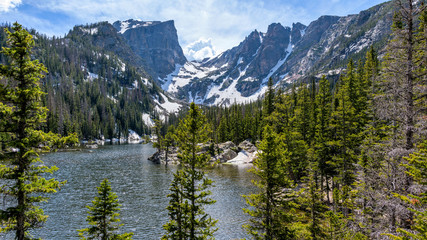 Spring Mountains - A panoramic Spring view of Hallett Peak and Flattop Mountain towering at shore of Dream Lake, Rocky Mountain National Park, Colorado, USA.