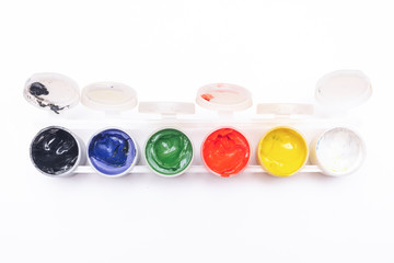 Gouache colorful paint in a jar isolated on white background.