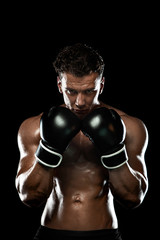 Fototapeta na wymiar Boxer, man fighting or posing in gloves on black background. Fitness and boxing concept. Individual sports recreation.