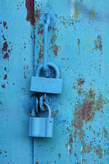 padlock on old metal door