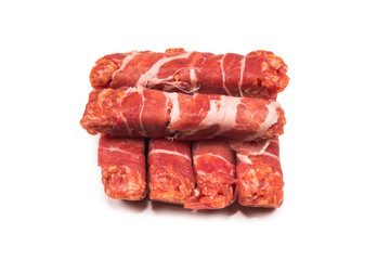 Chevapchichi in bacon isolated on white background.