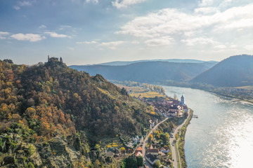 Panorama of Duernstein village with castle and Danube river during autumn in Austria