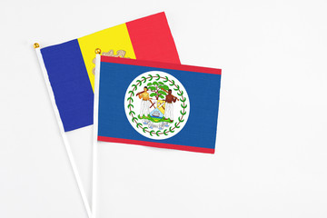 Belize and Andorra stick flags on white background. High quality fabric, miniature national flag. Peaceful global concept.White floor for copy space.