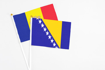 Bosnia Herzegovina and Andorra stick flags on white background. High quality fabric, miniature...
