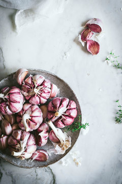 Close-up of a plate of pink garlic