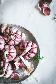 Close-up of a plate of pink garlic