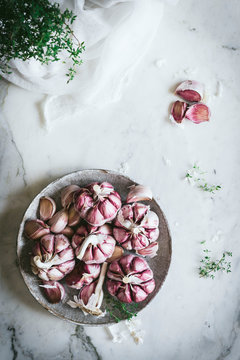 Close-up of a plate of pink garlic