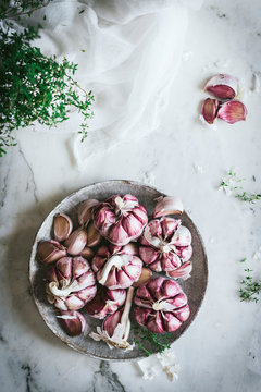 Close-up of a plate of pink garlic