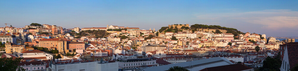 Fototapeta na wymiar Panoramic view of the Convento da Graca, Sao Jorge Castle (Saint George Castle, Castelo de Sao Jorge) and Alfama district in downtown Lisbon. Viewed from Miradouro de Sao Pedro de Alcantara viewpoint.