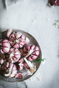 Close-up of a plate of pink garlic