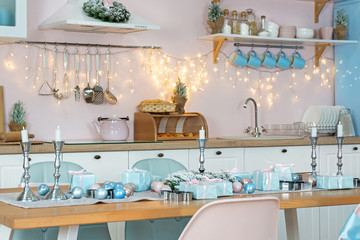 Closeup of Interior of modern white kitchen and luxury decoration and candles on a Christmas New year eve