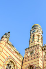 Obraz premium Vertical photo of the Great Synagogue in Budapest, Hungary. Known also as Dohany Street Synagogue, the largest synagogue in Europe. Centre of Neolog Judaism. Ornamental facade and a onion dome