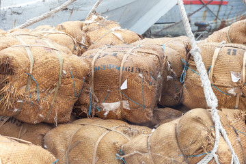 Cotton packages tied up and ready to be loaded. Cotton export in Indonesia. The packages are lift...