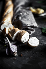 French pastry, baguette on a black background with details for cooking