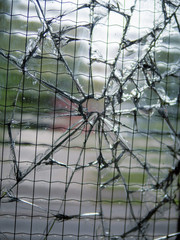 Broken safety glass, Close up, Concept vandalism, urban criminal area, safety.