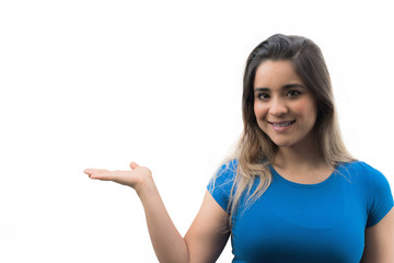 Fototapeta premium Isolated young woman showing her hand palm up. Smiling woman showing product