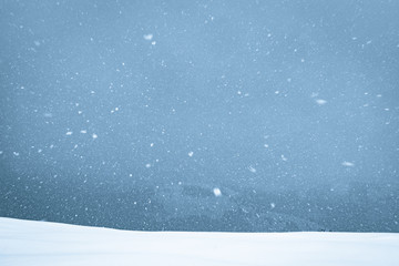 Snowstorm in winter mountains. Nature background snd Christmas holiday concept