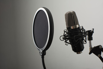 Microphone on stand with diffuser on a white background