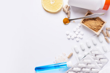 spices, pills, herbs on white background