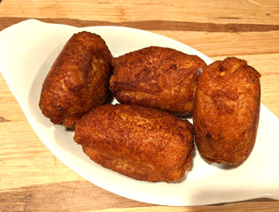 A plate of Indian Bread rolls stuffed with a spicy mixture of mashed potato.