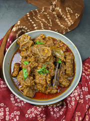 Overhead view of Goat curry, Mutton curry, Nihari, Rogan Josh in a bowl .