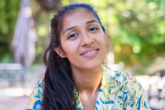 Young Indian Woman Laughing In The Park