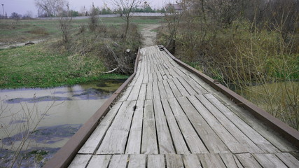 Dilapidated Bridge Over the River