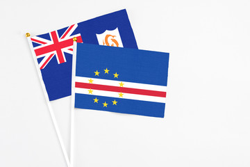 Cape Verde and Anguilla stick flags on white background. High quality fabric, miniature national flag. Peaceful global concept.White floor for copy space.