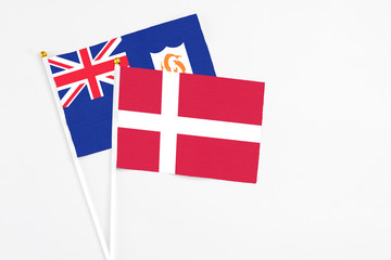 Denmark and Anguilla stick flags on white background. High quality fabric, miniature national flag. Peaceful global concept.White floor for copy space.