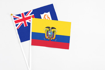 Ecuador and Anguilla stick flags on white background. High quality fabric, miniature national flag. Peaceful global concept.White floor for copy space.