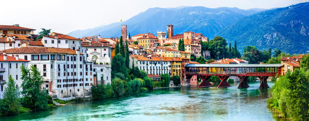 Beautiful medieval towns of Italy -picturesque  Bassano del Grappa .Scenic view with famous bridge. Vicenza province,  region of Veneto - obrazy, fototapety, plakaty