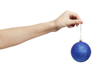 Christmas pink toy ball for the Christmas tree іn hand isolated on a white background.