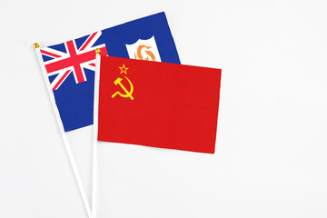 Fototapeta premium Soviet Union and Anguilla stick flags on white background. High quality fabric, miniature national flag. Peaceful global concept.White floor for copy space.