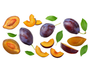 fresh plum fruit with green leaf and cut plum slices isolated on white background. top view