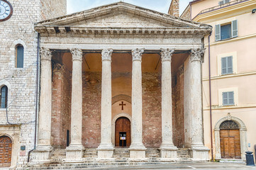Facade of Temple of Minerva, iconic landmark in Assisi, Italy