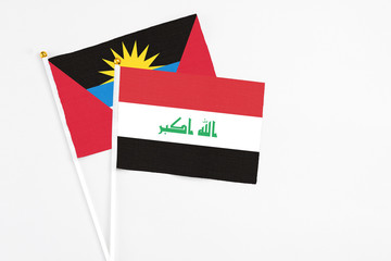 Iraq and Antigua and Barbuda stick flags on white background. High quality fabric, miniature...