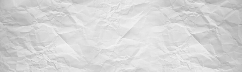 wide panorama crumpled paper texture background. crush paper so that it becomes creased and wrinkled.