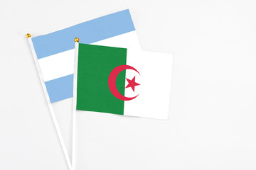 and Argentina stick flags on white background. High quality fabric, miniature national flag....