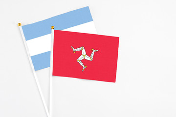 Isle Of Man and Argentina stick flags on white background. High quality fabric, miniature national...