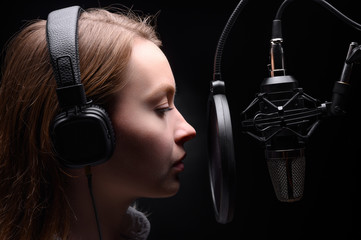 Radio presenter working on the radio, with dramatic light.