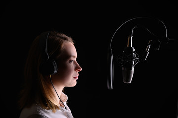 Singer, blogger, voice acting. Work in the studio with a studio microphone.