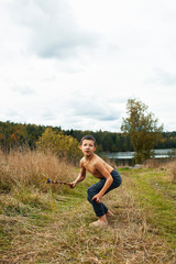 little cute boy playing outside like wild indian chief, lifestyle real people concept