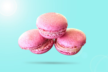 pink macaroons , confectionery, isolated on blue background, toned
