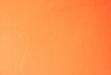 Fototapeta premium Orange painted wall texture with copy space your writing text on empty background.