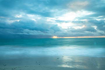 Fototapeta na wymiar Storm coming at sunrise Isla Blanca Cancún Mexico